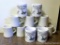 Seven heavy stoneware coffee cups by Victor and Shinago. Four cups from the Northcentral Wisconsin