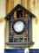 Great cabin clock depicting deer, ducks, rifle, hat, more. Measures approx. 11-1/2