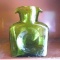 Blenko glass carafe in a retro green stands 8