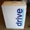 NIB Drive deluxe all-in-one steel commode with plastic armrests.