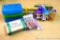 Pencil boxes, boxes of Crayola crayons, flower pressing kit, two Trolls, more