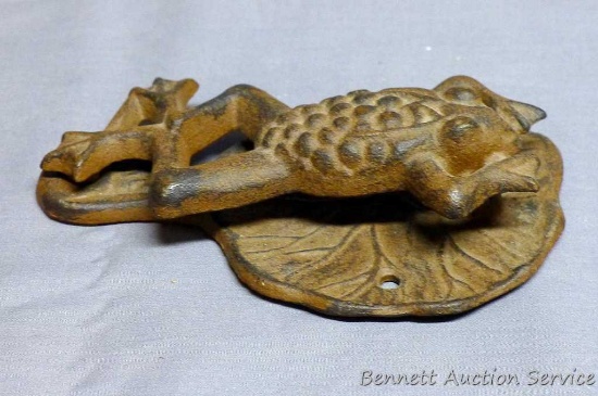 Cast iron frog and lily pad door knocker is about 6" tall.