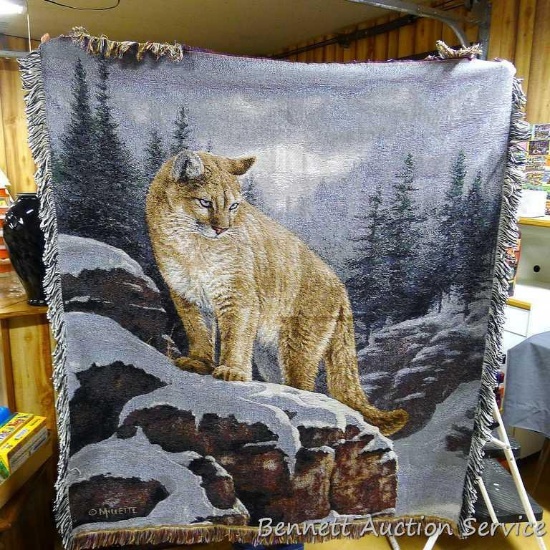 Nice woven blanket with mountain lion design measures approx. 27" x 48".