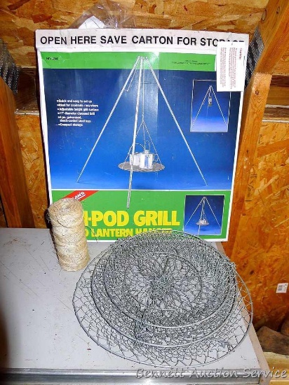17" diameter campfire grill with tripod is new in box with some corrosion; Hanging wire baskets,