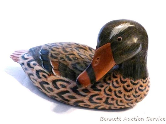 Carved wooden duck is approx. 12" long and in good condition with a couple of small chips.