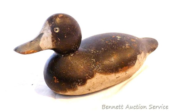 Antique wooden duck decoy with glass eyes is approx. 13" long and in overall nice condition. Great