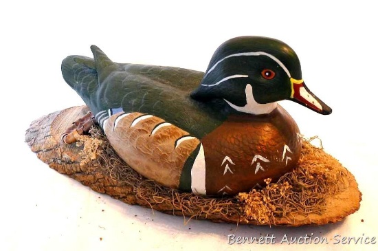 Ceramic duck mounted on wooden slab. Approx. 18" overall.