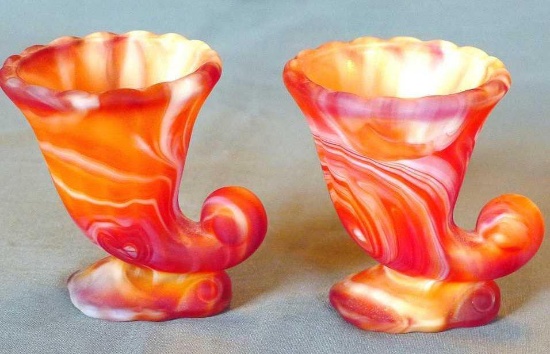 Pair of Imperial Glass red slag glass Cornucopia No. 123. Both are in good condition.