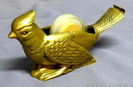 Lovely brass cardinal tape dispenser is unique and in good shape. Measures 6" long overall.