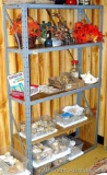 Sturdy set of metal shelving. Three shelves have a piece of wood protecting the metal shelf. Second