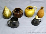 Three stoneware vases; one small pitcher; one cup and one cruet. Taller vase stands 6-1/2