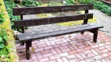 Sturdy wooden park bench is in overall good shape, measures 6' long.