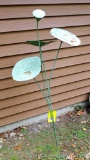 Metal lily pad yard art stands about 4' tall. Nice piece.
