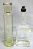 Unique spyglass shaped bottle; other bottle is marked 'Loaned by A.R. Winarick Inc. Made in USA',