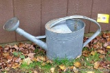 Neat old galvanized watering can is in overall good shape - minor splitting at bottom seam. Great