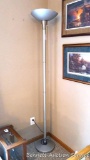 Brushed finish floor lamp with three way socket stands 6' tall. Reflector is oblong.