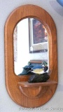 Red oak framed mirror with shelf is approx. 26