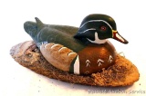 Ceramic duck mounted on wooden slab. Approx. 18