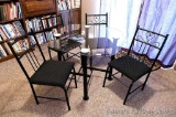 Glass topped table with four chairs. Table is 3' square, stands 29
