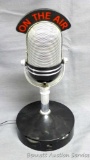 One the Air microphone shaped radio is in good working order. Neat piece.