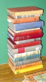 Collection of old books, copyright dates range from the 1920s to the 1940s. Titles include The