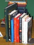 Christmas themed books including The Annotated Christmas Carol; Mystery for Christmas; The Judge Who