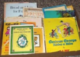 Vintage children's books with records including Curious George Rides a Bike; The Emperor's Clothes;