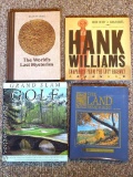Coffee table books including Hank Williams, Grand Slam Golf, The Land Remembers, and The World's