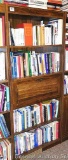 Bookcase with four shelves and fold down door stands 70-1/2