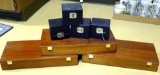 Three wooden Cabot Medical boxes would be great repurposed pieces; Four little black boxes would