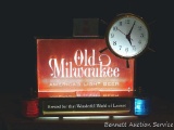 Old Milwaukee lighted clock with chime. Clock sets and runs. Old Milwaukee logo lights up. Green