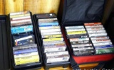 Cassette tape collection with organizers. Tapes include Asleep at the Wheel, Dean Martin, Harry