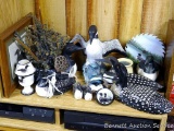 Collection of loon items including figures, lamp, candleholder, planter, ornaments, painted saw