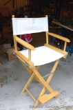 Director's chair is stool height and in very good condition. Stands 44