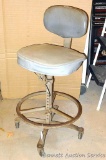 Rolling shop stool with vinyl padded back and seat. Seat vinyl needs some attention. Overall in good