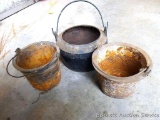 Three cast iron pots nest together - not sure how this should be used. Bottom piece is 4