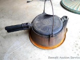 Cast iron Favorite Piqua-Ware No. 8 waffle iron has rare high base with wire bale handle