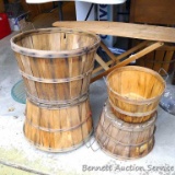 Two bushel baskets and two smaller bushel-style baskets. One of the bushel baskets is missing parts