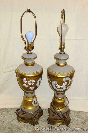 Two matching vintage lamps. Approx. 38" tall incl harps. Bases show wear, see pictures. Both lamps
