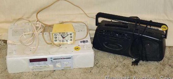 GE Spacemaker AM/FM stereo cassette player, Model 7-4287A; Timex alarm clock; Lenoxx Sound AM/FM