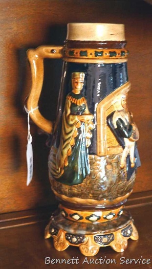 Large hand painted ceramic stein. Approx. 13" high. Has a couple of chips on bottom edge.
