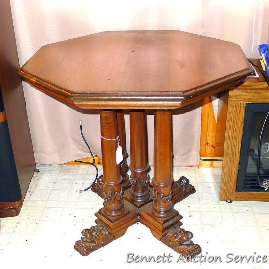 Beautiful vintage pedestal octagon table with lion accent feet. Table is approx. 29" x 29" x 28"