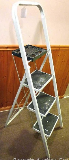 Fold out step ladder with paint tray and handle. Has three steps. Highest step is 28". Sturdy. Has