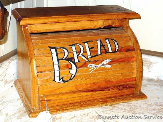 Wooden bread box with roll top lid. 16-1/2" w x 11" d x 12-1/2" h.