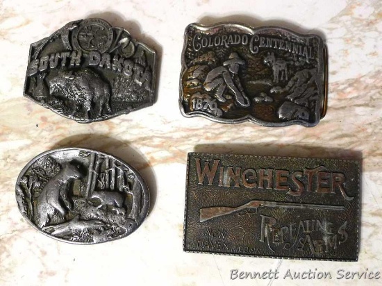 Winchester, South Dakota, Colorado Centennial and Black Bear belt buckles. Largest is 4".