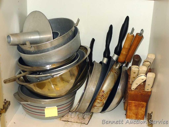 Angel food cake pan, colander, metal bowl, skillets, knives, knife block and more.