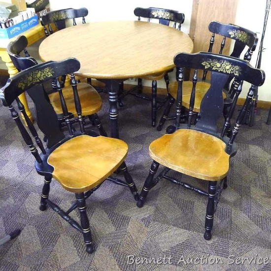 Lovely round table with six matching chairs and two leaves. Table is 45" without extra leaves, each