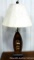 Katy Creek table lamp with boat shaped base and lure accents.