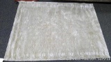 American Design Brilliance area rug, 5' x 7'. Color is champagne. 100% viscose cut & loop.