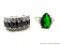 Two rings. Seller's description states 'black sapphire ring, size 7; green emerald ring, size 7'.